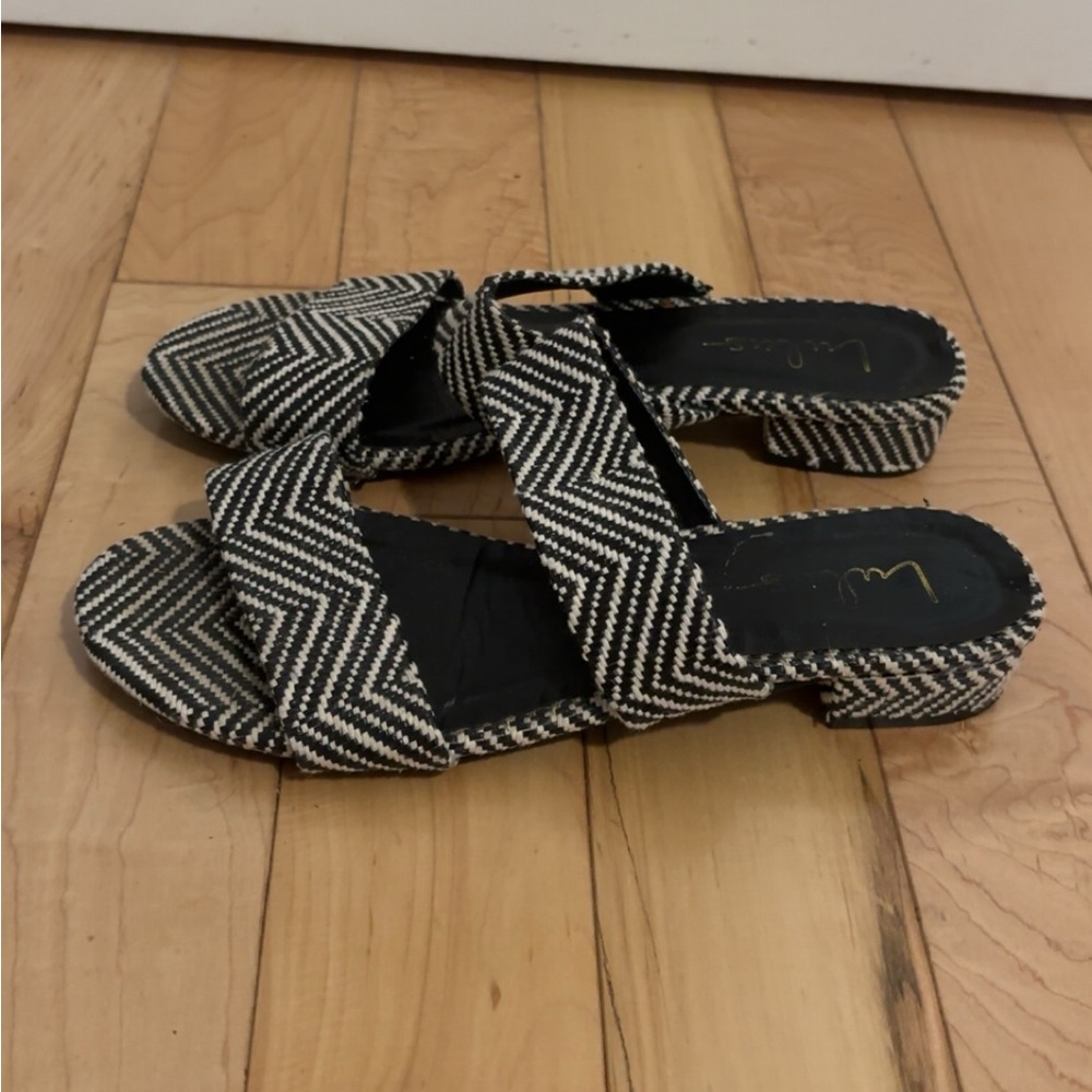 LULU’S DECKER WHITE AND BLACK WOVEN SLIDE SANDALS